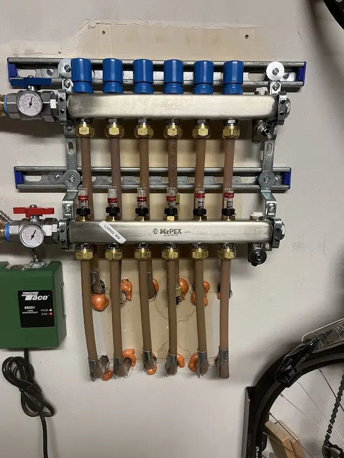 Plumber performing Water Heater Repair at a residential property in Conley